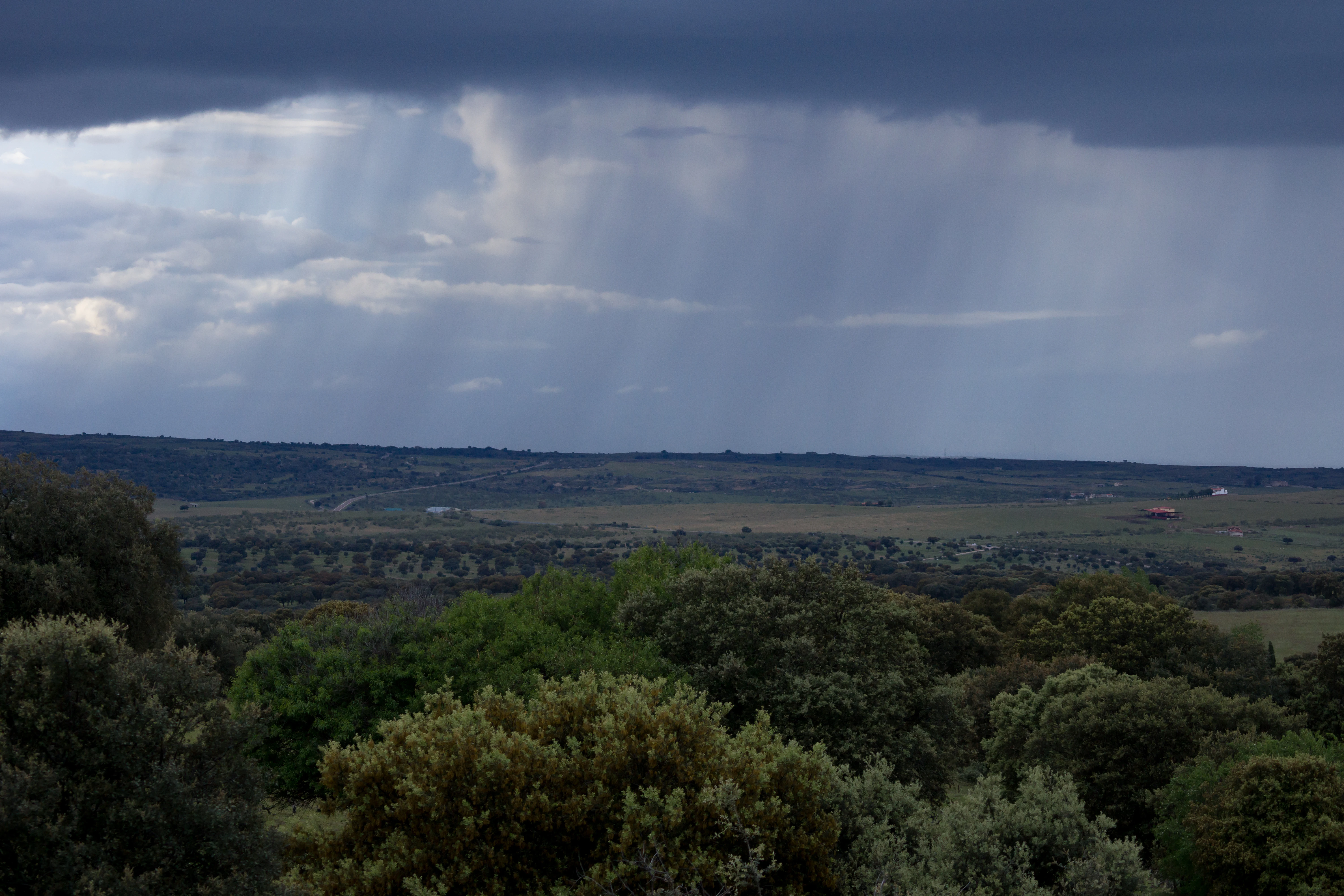 Rain on the plain, viewd from our hotel, Vinas Las Torres, Trujillo, Extremadura, Spain — photo by Jim Bennett