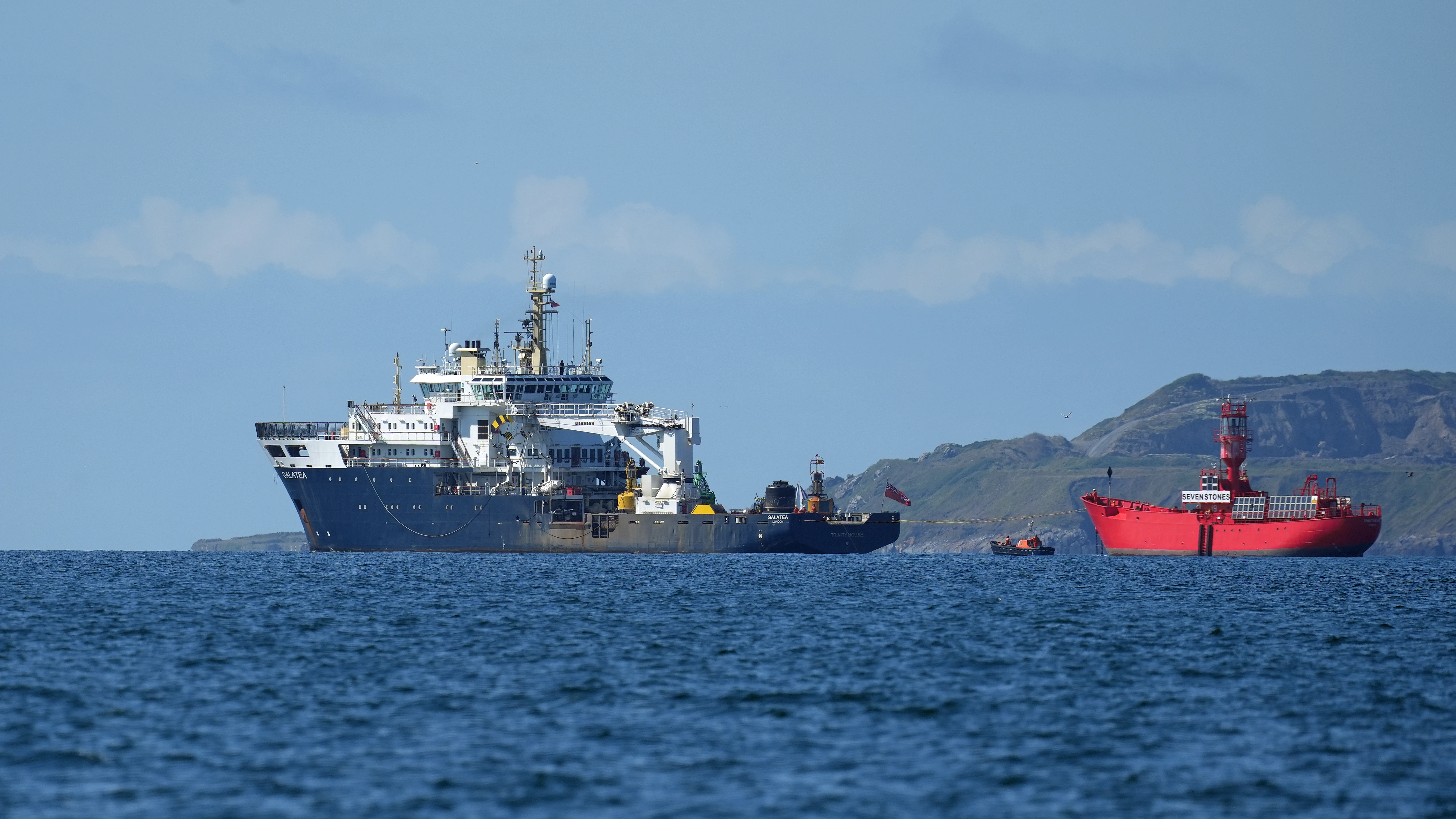 Lightship being towed out, Falmouth Bay, Cornwall, UK — photo by Jim Bennett