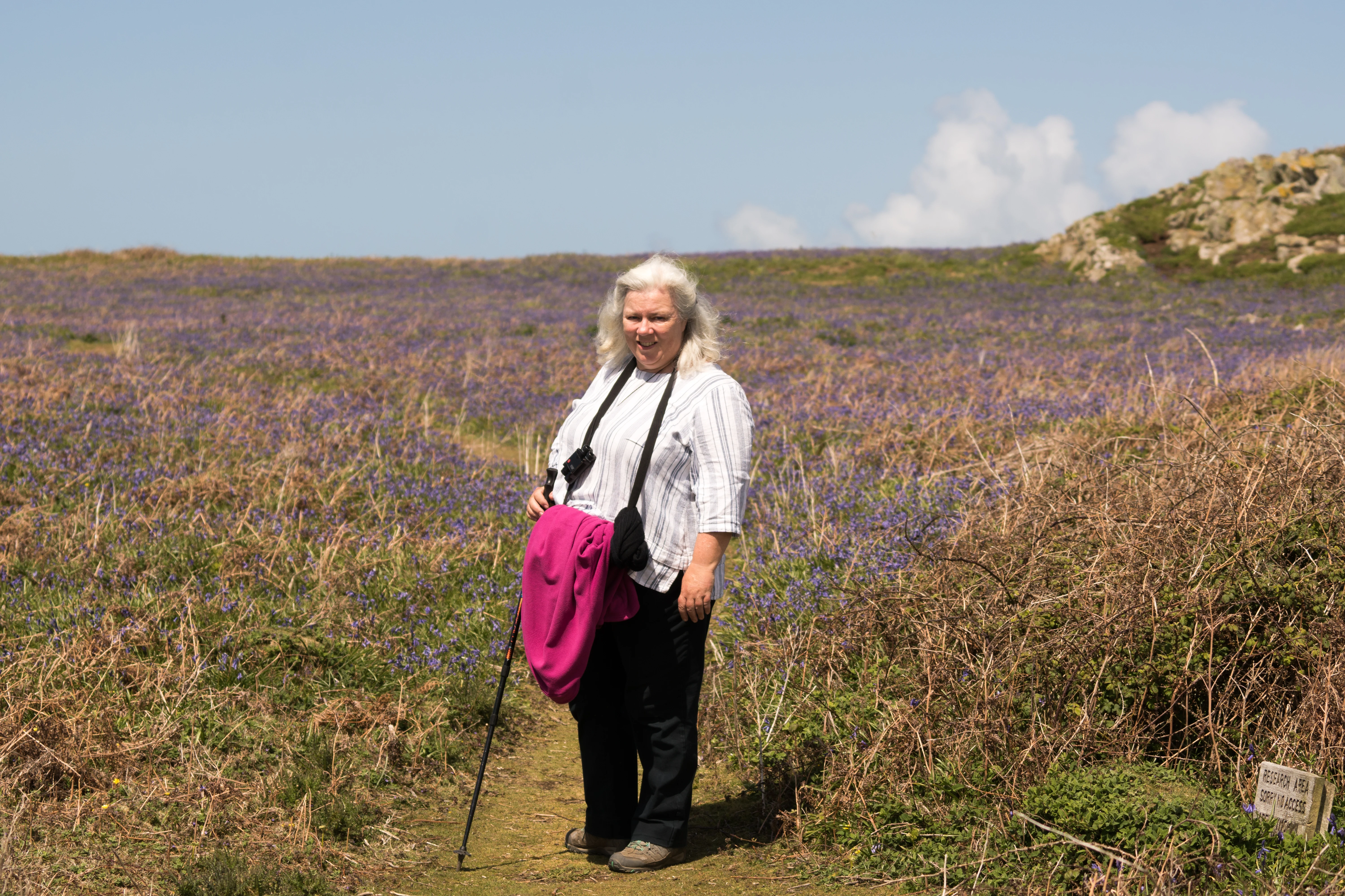 Caroline & Bluebells, Skomer, Pembrokeshire, UK — photo by Jim Bennett
