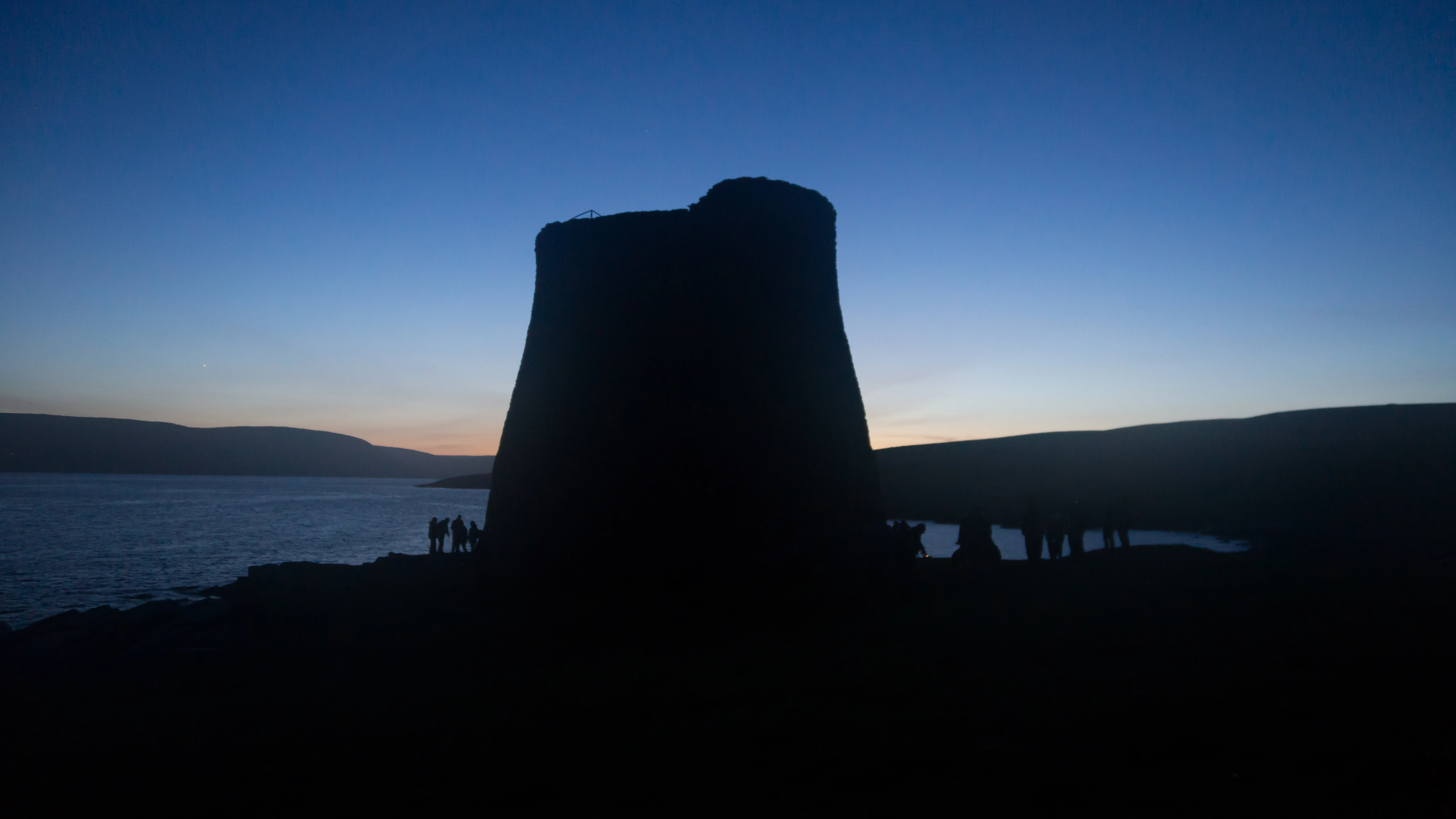 The Broch of Mousa, with the simmer dim behind, Mousa, UK — photo by Jim Bennett