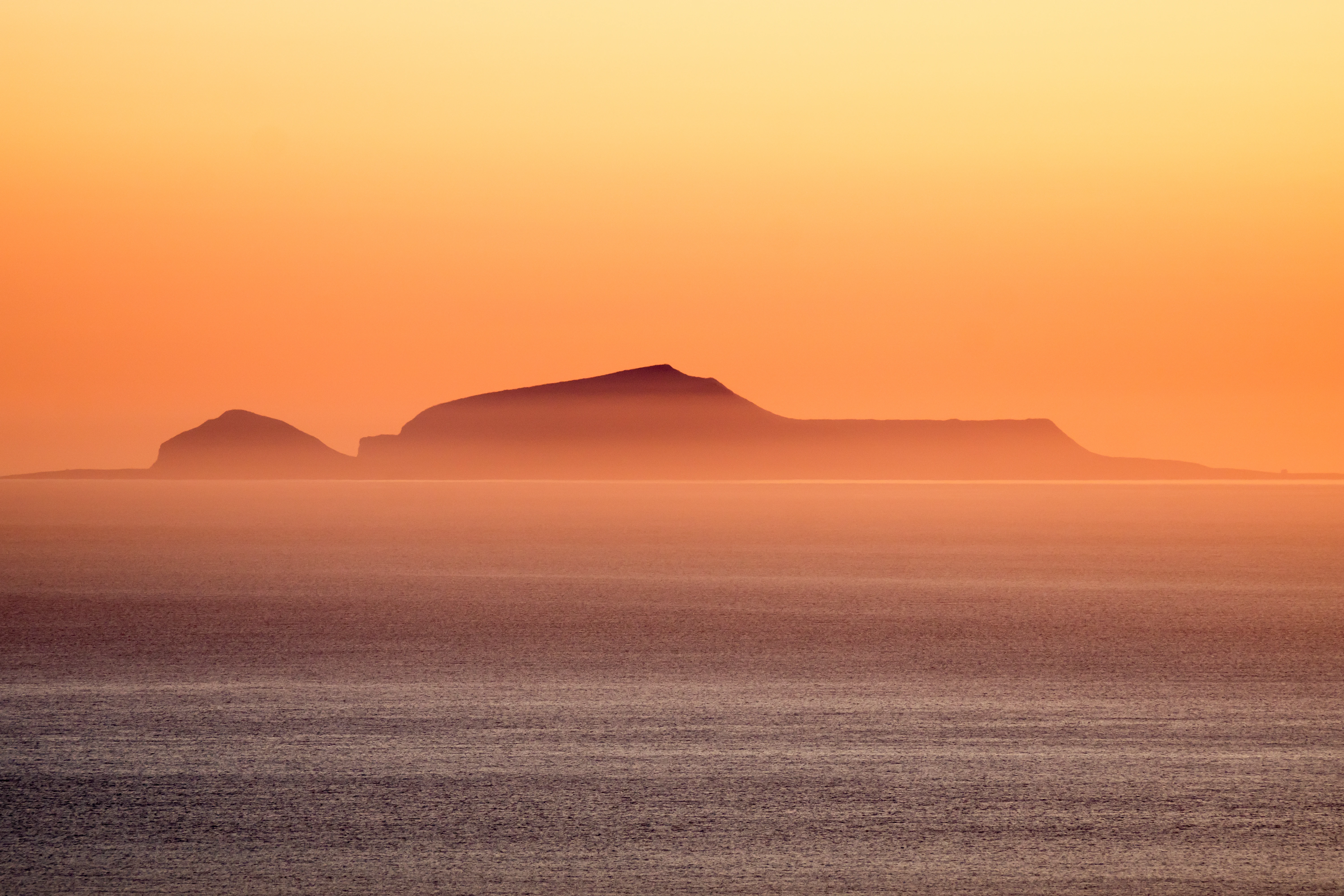 Foula in the sunset, Shetland, UK — photo by Jim Bennett