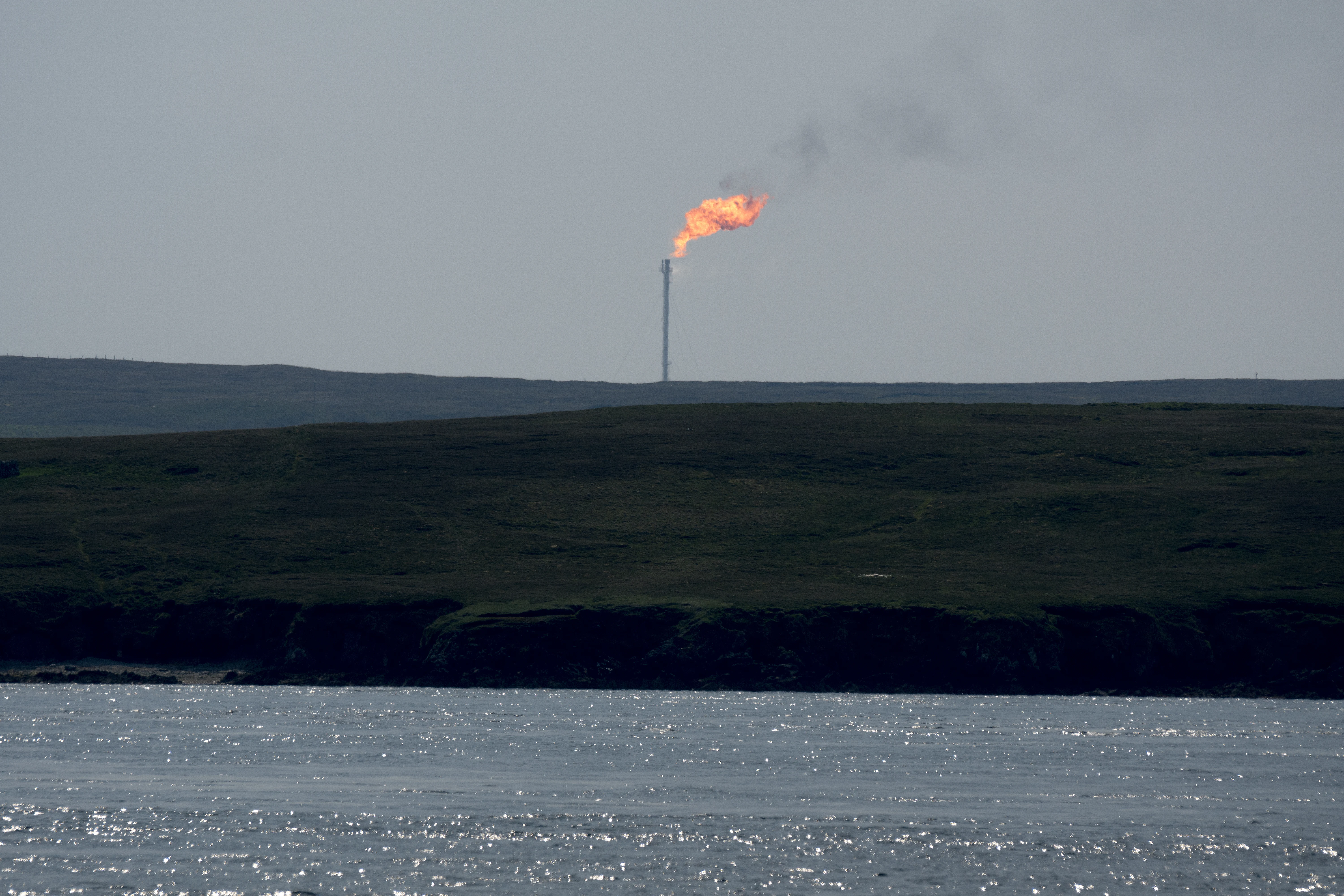 Flaring off gas prior to maintenace work on the gas tanks, Shetland, UK — photo by Jim Bennett