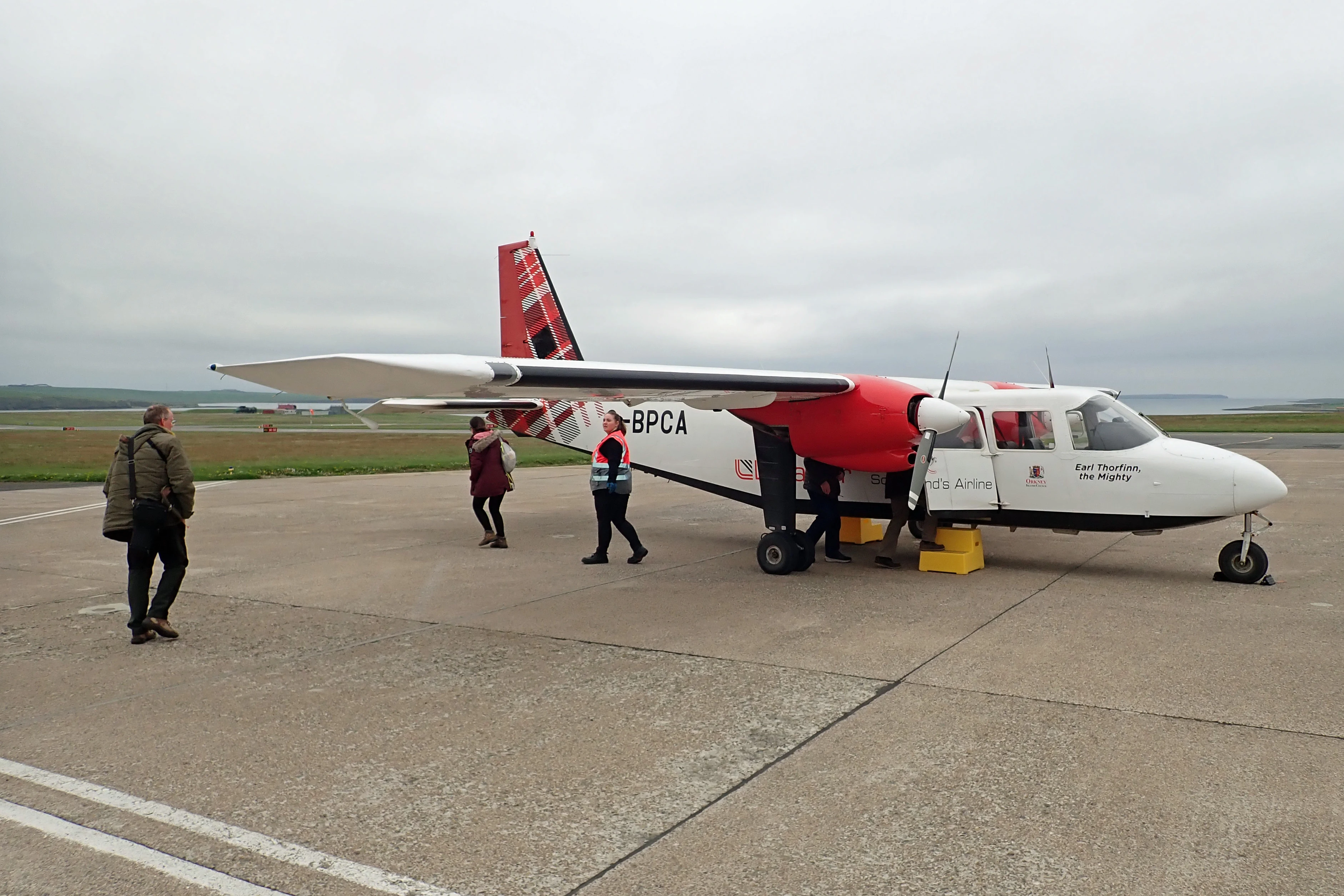 Adam embarking, Kirkwall Airport, Orkney, UK — photo by Jim Bennett