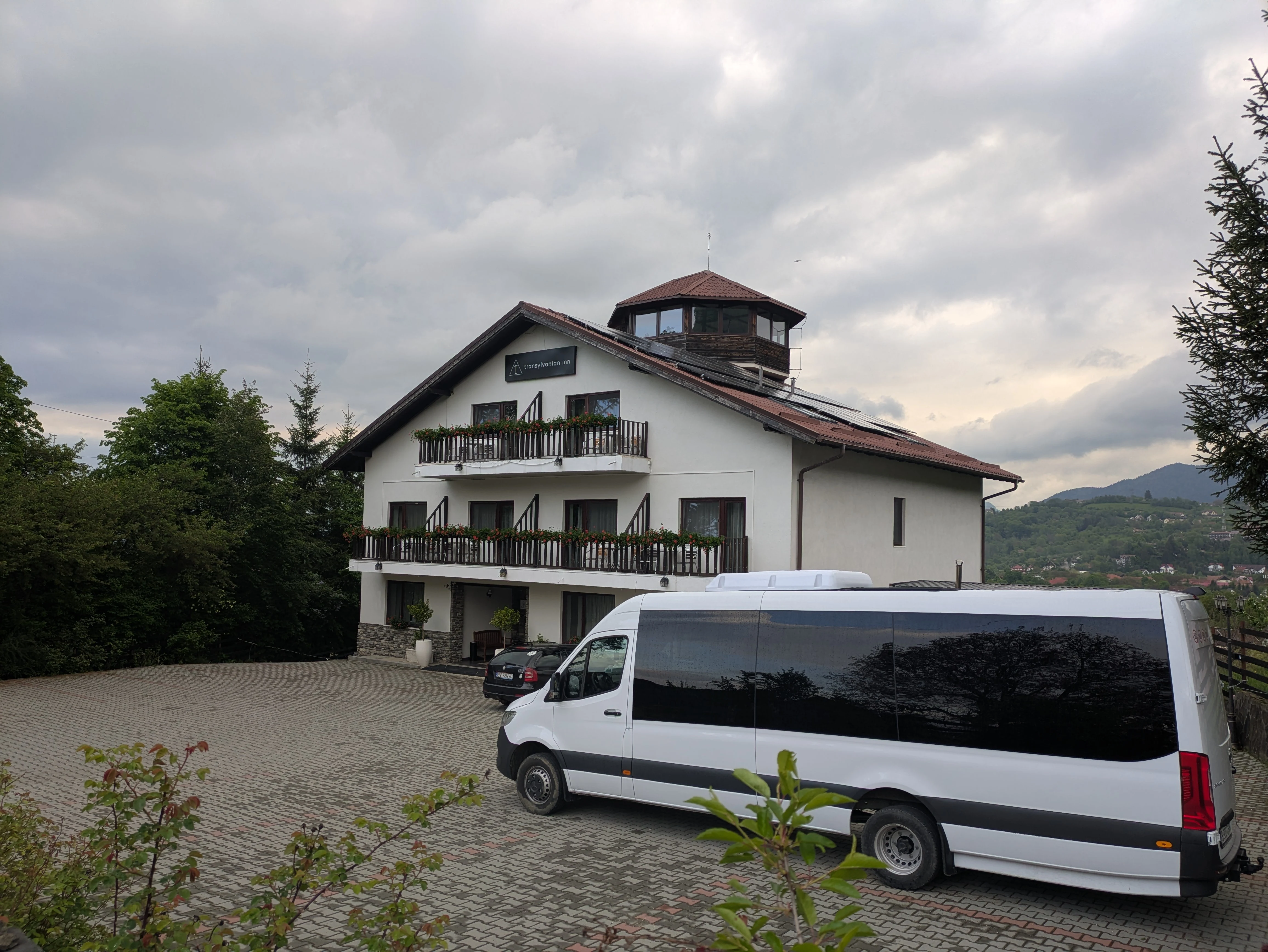 Our minibus & hotel, Bran, Transylvania, Romania — photo by Jim Bennett