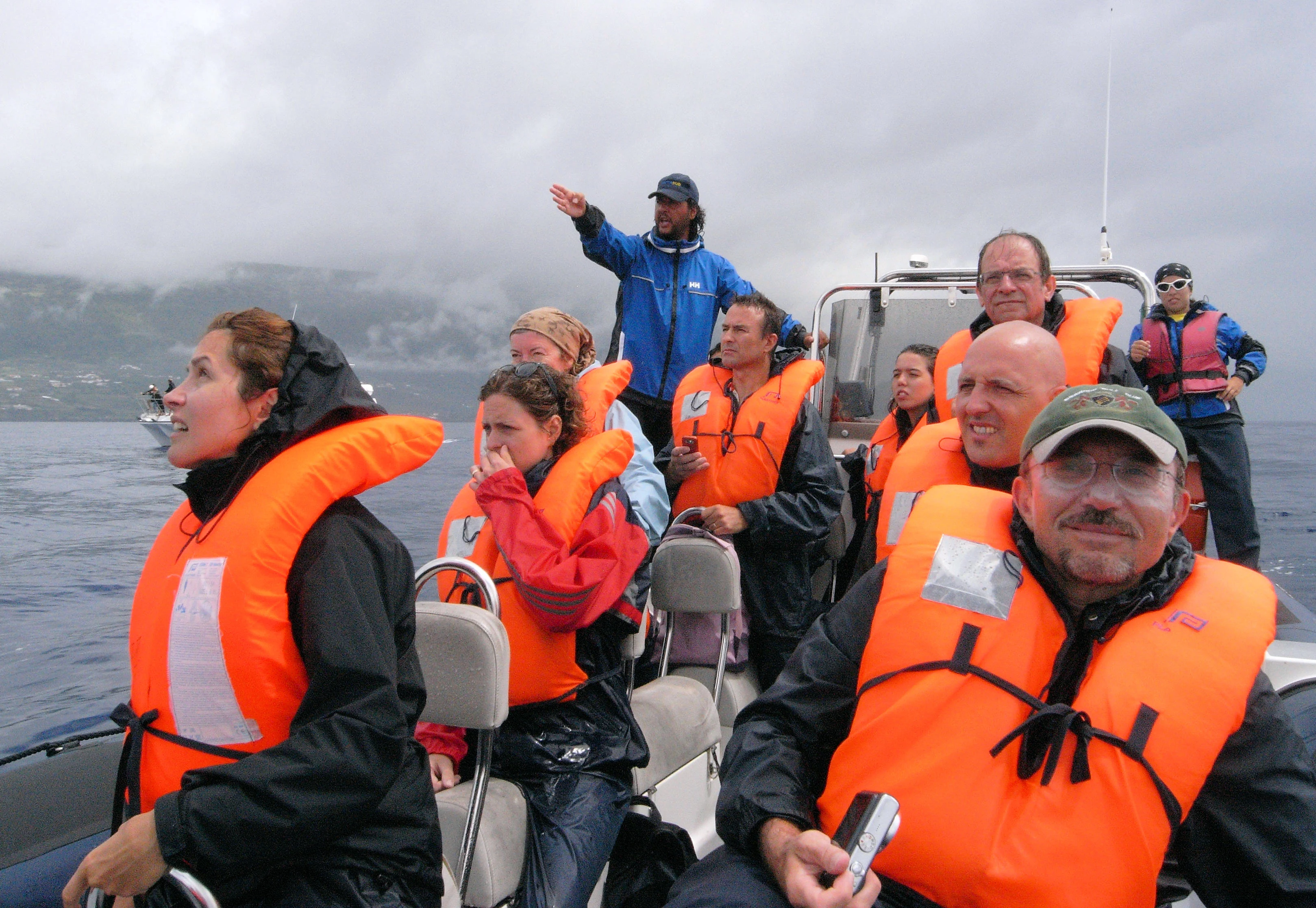 Pedro at the Helm, off Pico, Azores, Portugal — photo by Jim Bennett