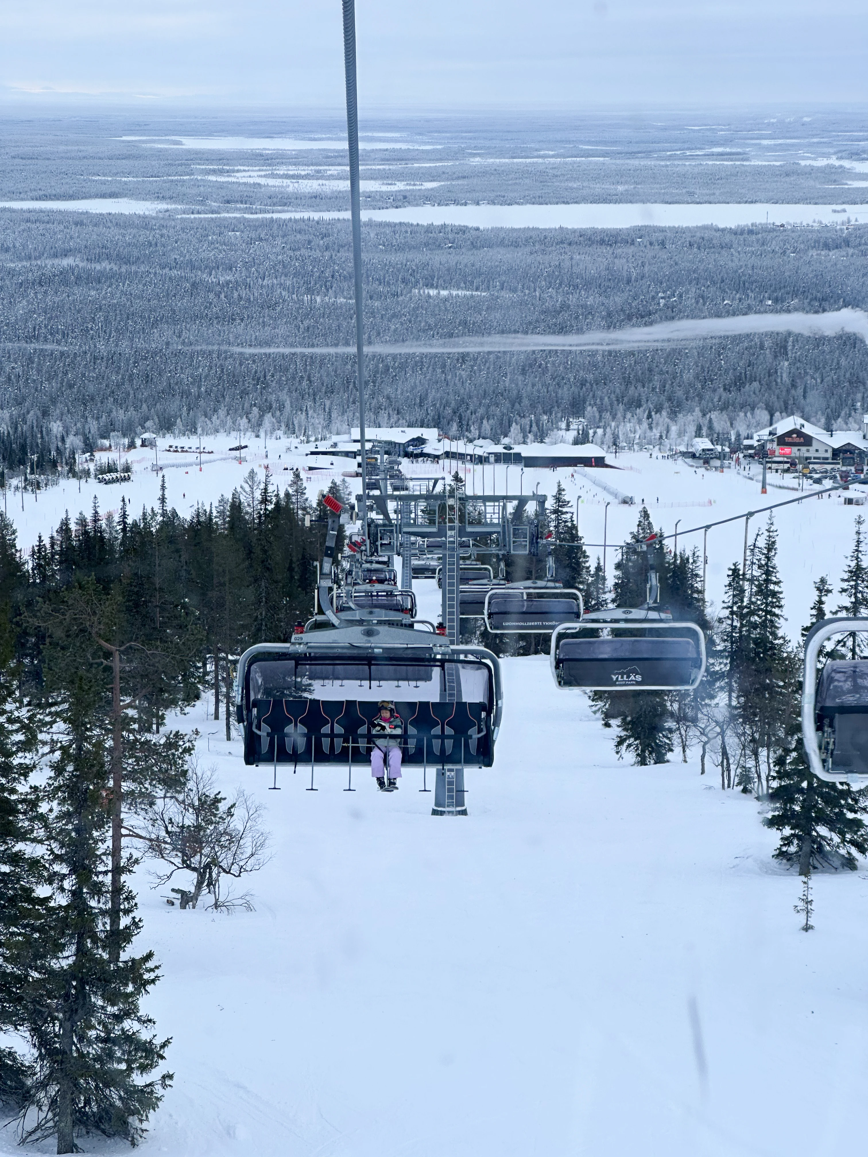Martha on the chair lift, Ÿllas, Finland — photo by Orlando Prugel-Bennett
