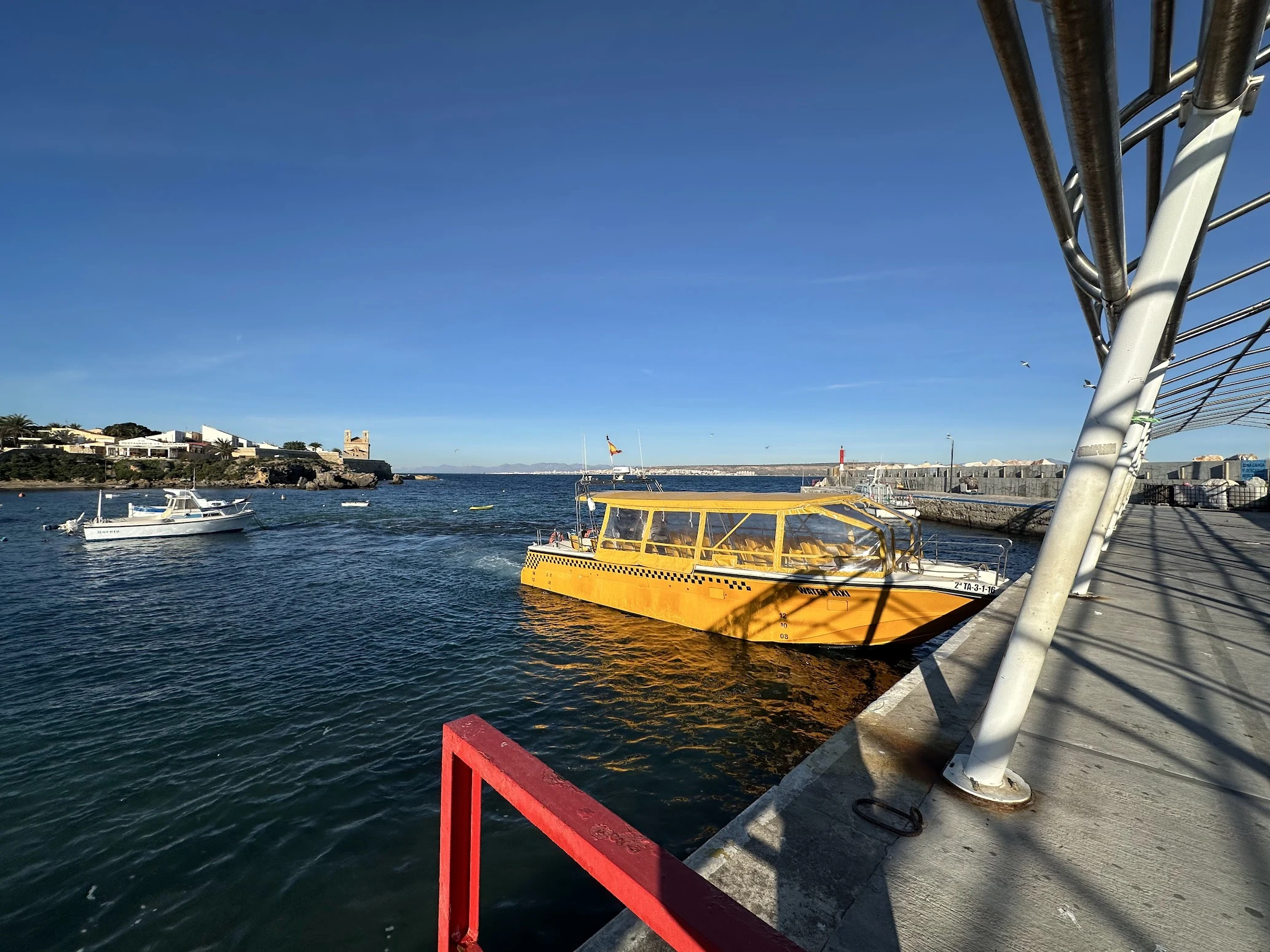 Yellow water taxi at Tabarca island port, Tabarca, Alicante, Spain — photo by Orlando Prugel-Bennett