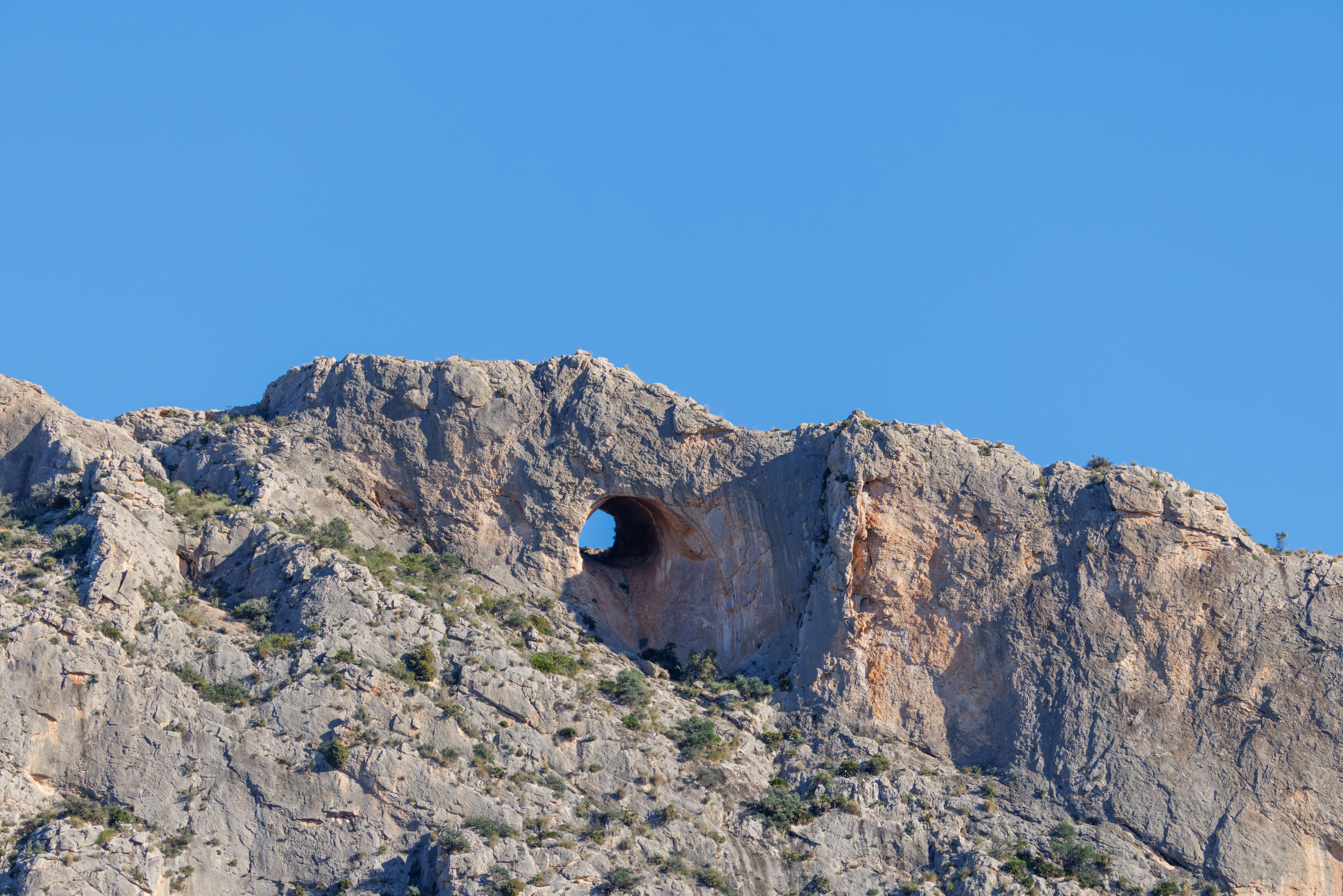 Round mountain hole, Maigmo, Alicante, Spain — photo by Orlando Prugel-Bennett